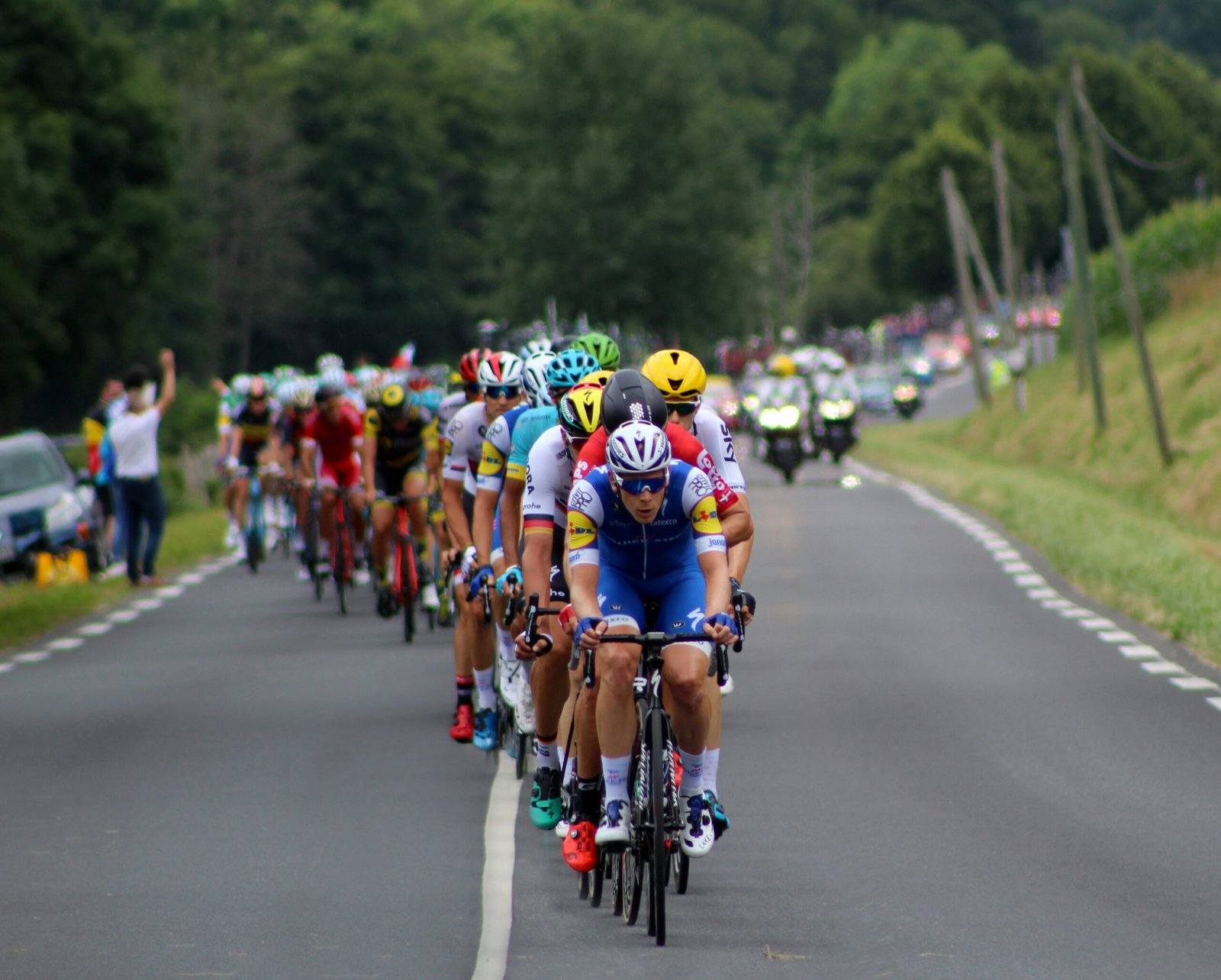 Barcelona and Monaco

group of cyclists marching on highway